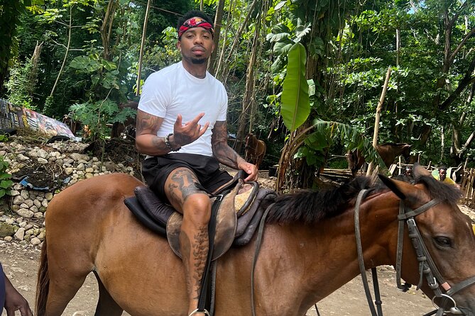 ATV , Bamboo Rafting & Horseback Ride Tour From Montego Bay - ATV riding through mud and countryside