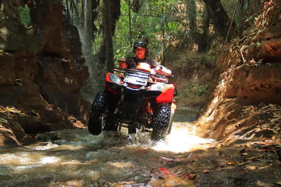 Bali: ATV and Ayung River Rafting Adventure Combo - Taking the Tarantula ATV onto muddy trails