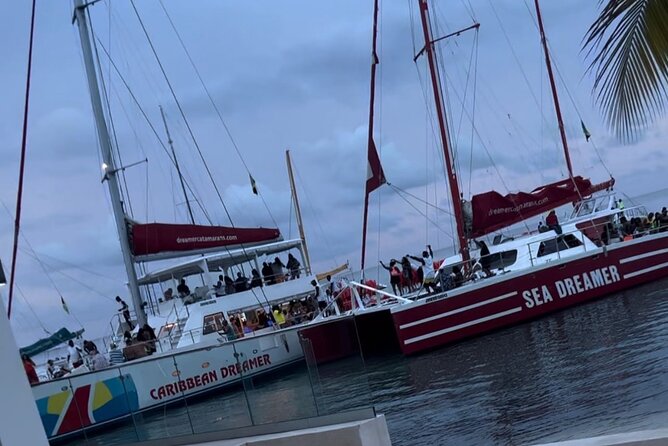 Bamboo Rafting, Catamaran Party Cruise and Snorkeling in Jamaica - Sunset at Rick’s Café