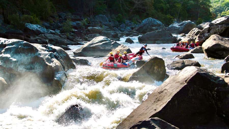 Cairns: Raging Thunder Barron Gorge River Rafting Trip - Calm water, rainforest views, and Grade 2 and 3 rapids