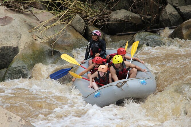 Chiang Mai Rafting in Mae Taeng River with Thai Buffet - Getting ready with helmets, life jackets, and paddles