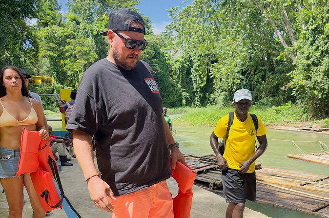 Experience Day Rafting on the Martha Brae River - Boarding the raft on the Martha Brae