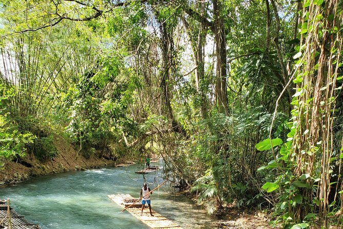 Martha Brae Bamboo River Rafting With Transportation - A slow river ride in rural Jamaica