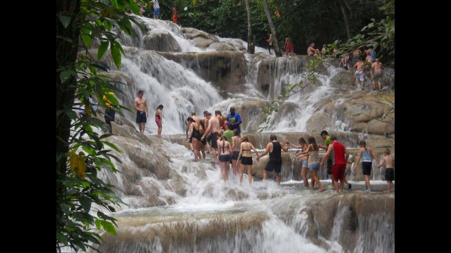 Montego Bay: River Rafting and Dunn's River Falls Day Trip - Floating through the Rio Nuevo rainforest