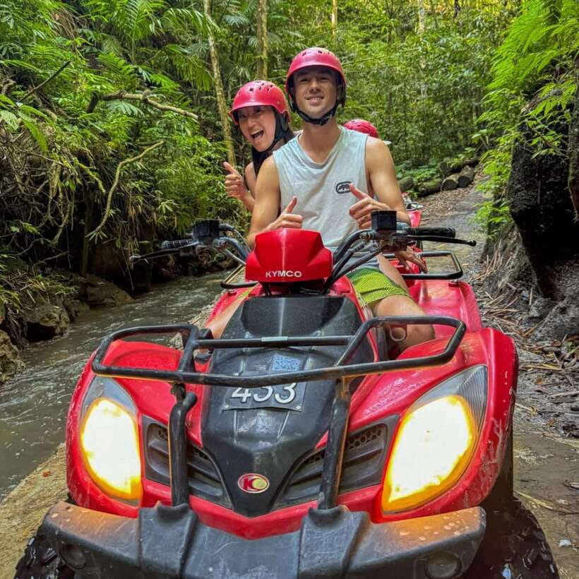 Ubud: ATV Quad Bike and Water Rafting Trip with Lunch - Rafting through green scenery near Ubud